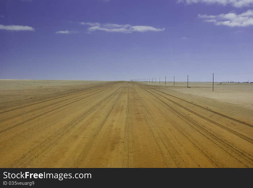 Empty road in Namibia, sky with clouds, you can place whatever you want on it