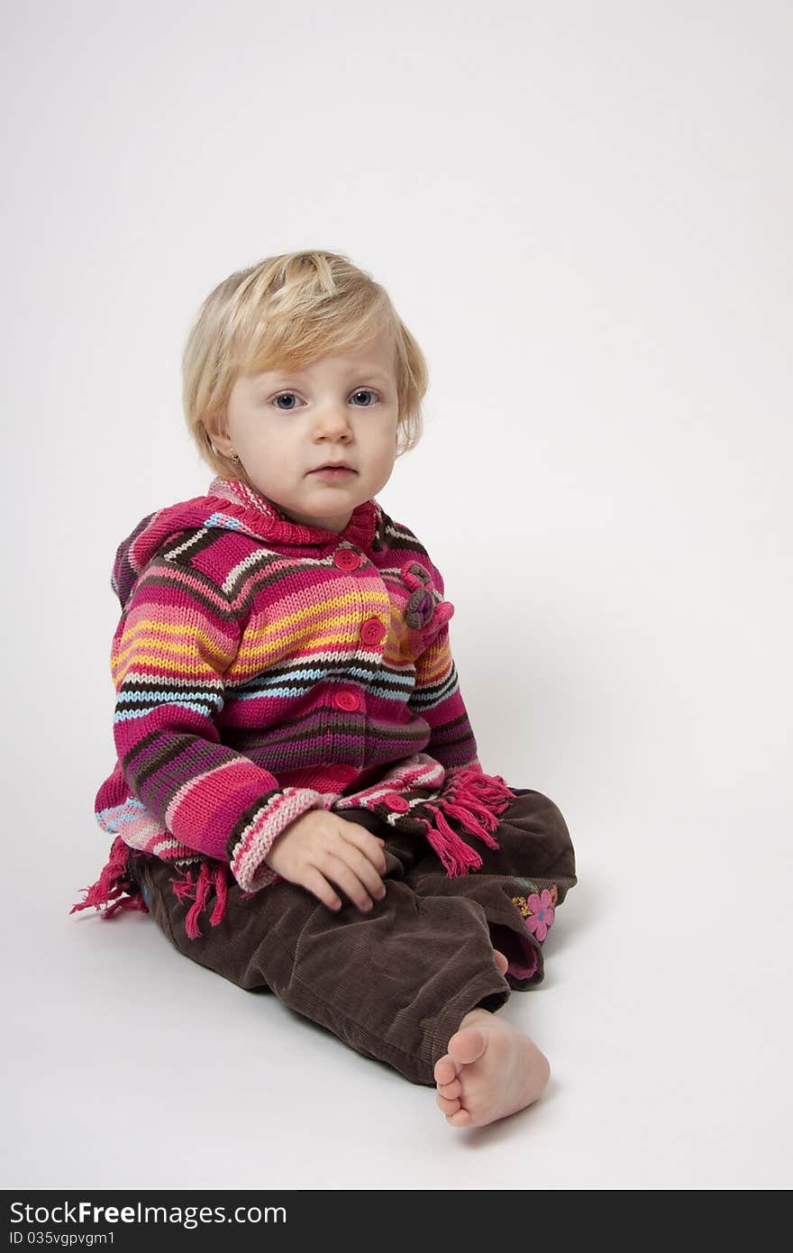 Portrait of cute girl sitting on the floor. Portrait of cute girl sitting on the floor