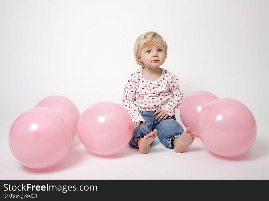 Cute girl with pink balloons