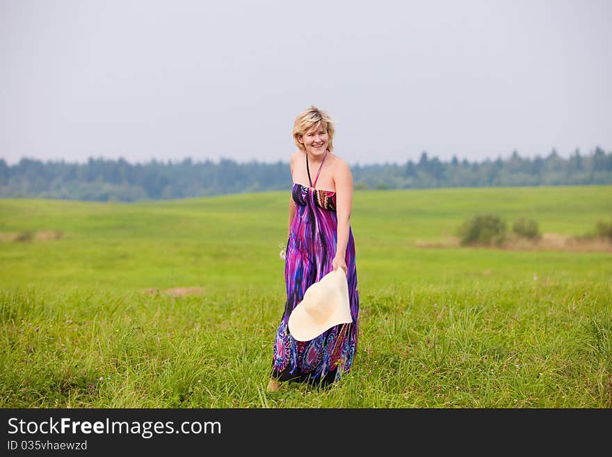 The young beautiful girl on a meadow