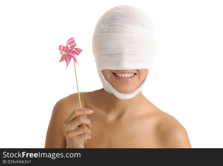 Young woman with bandaged head with toy