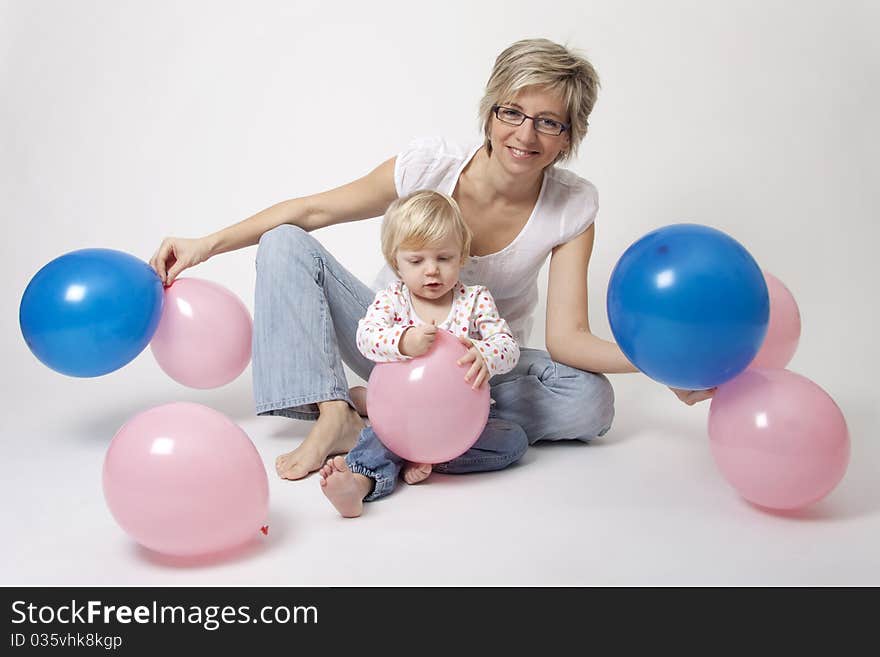 Mother and daughter portrait with balloons