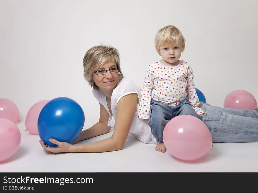 Mother And Daughter Portrait With Balloons