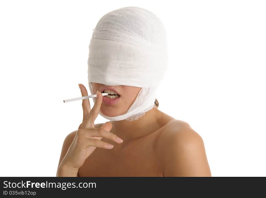 Young woman with bandaged head with cigaret