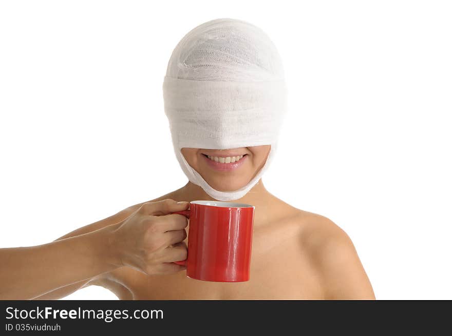 Young woman with bandaged head with red cup