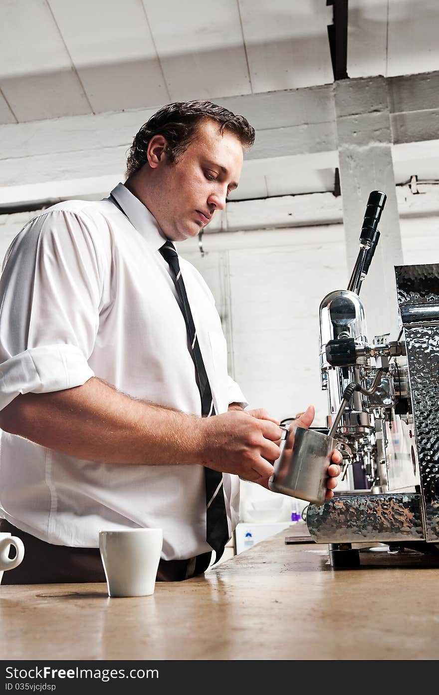 Professional expert barista makes coffee with a machine. Professional expert barista makes coffee with a machine