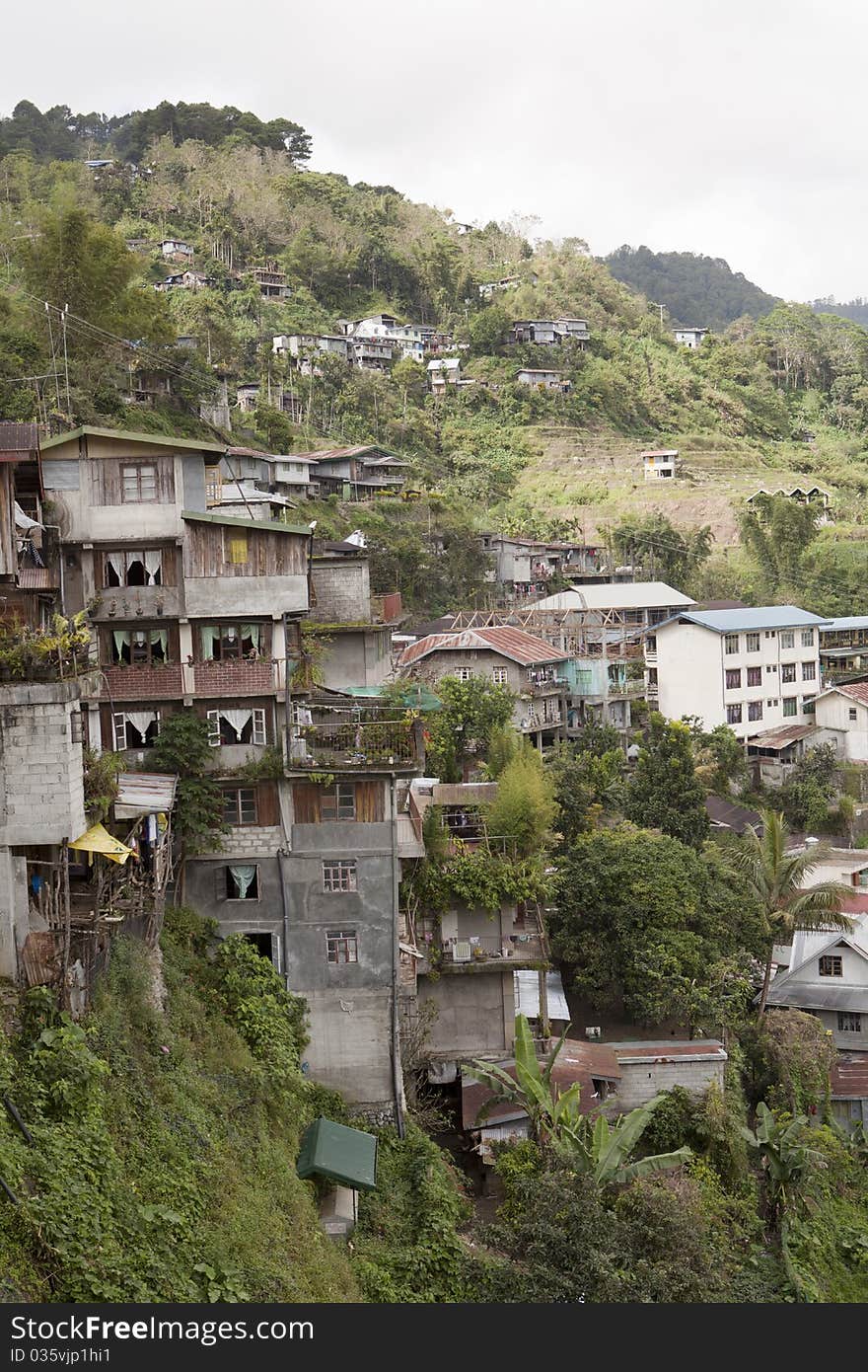 Houses built precariously on the side of a hill in banaue The Philippines. Houses built precariously on the side of a hill in banaue The Philippines