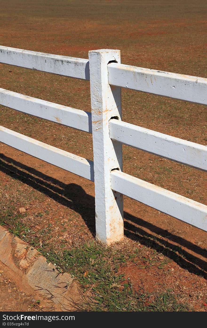 White pole fence in country farm.