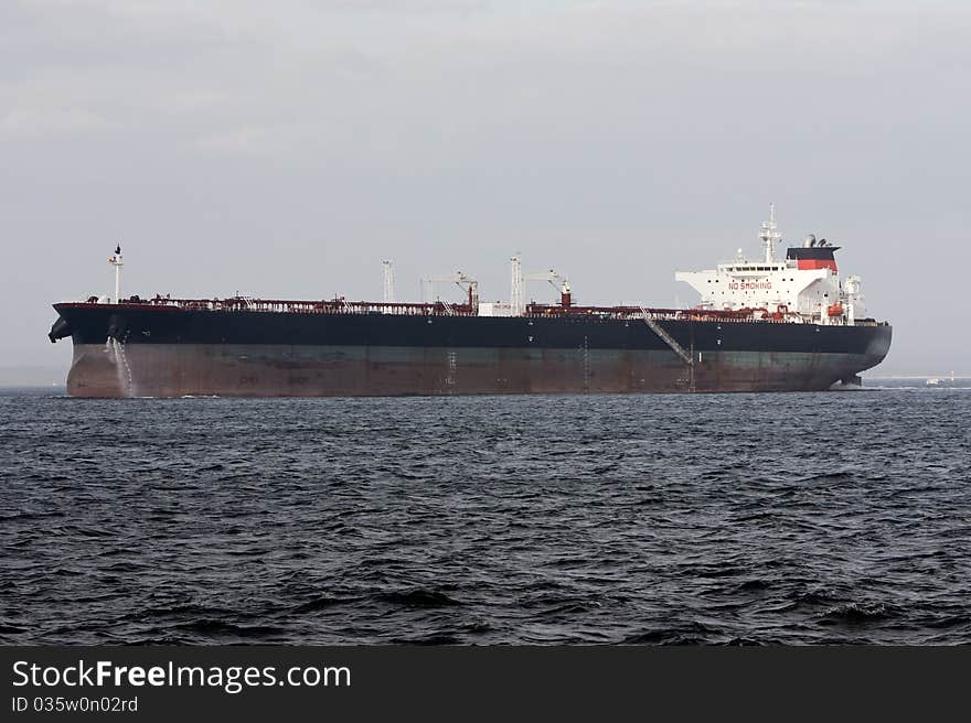 Oil super tanker under power at sea.