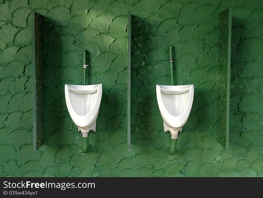 Men toilet with white urinal