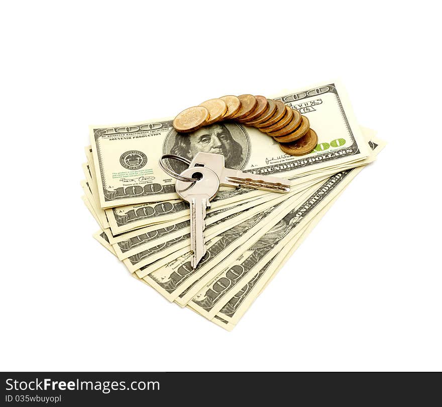 Keys and stack of dollars isolated on a white background