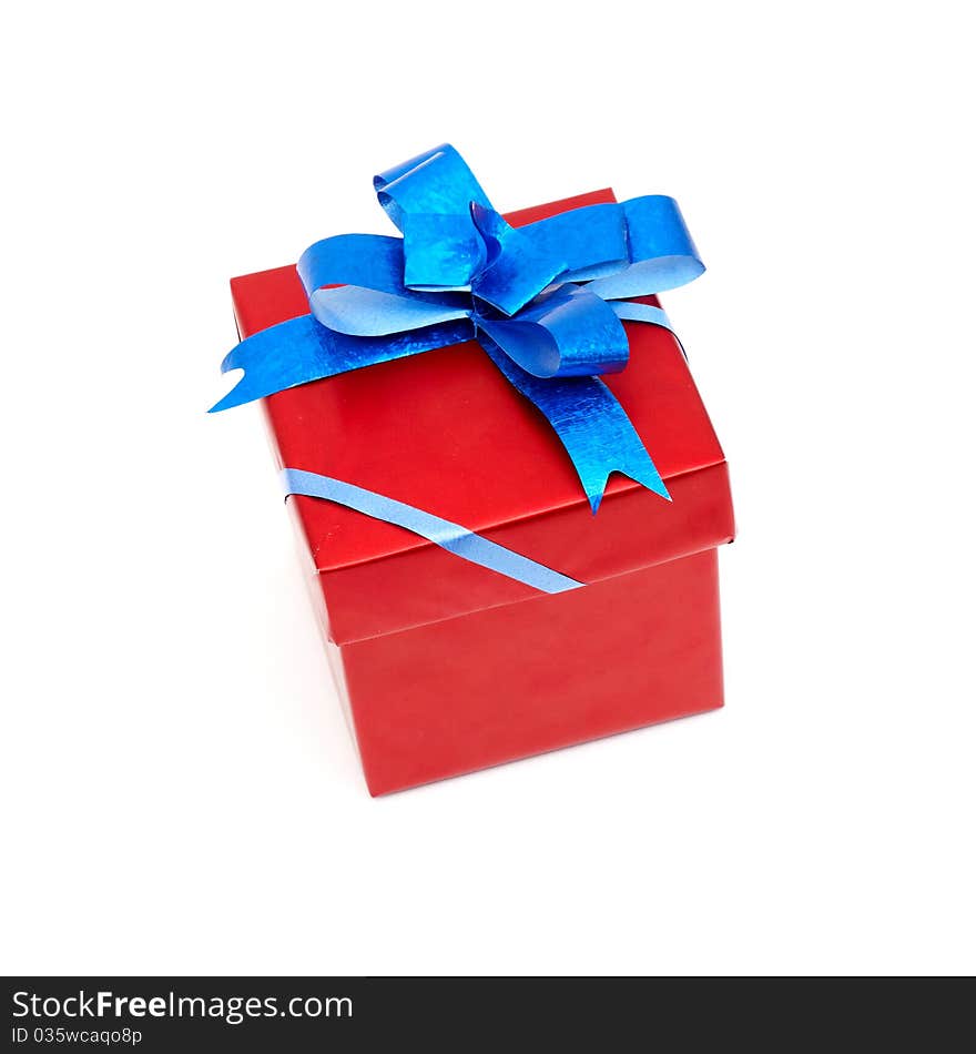 Red gift box with blue bow isolated on white