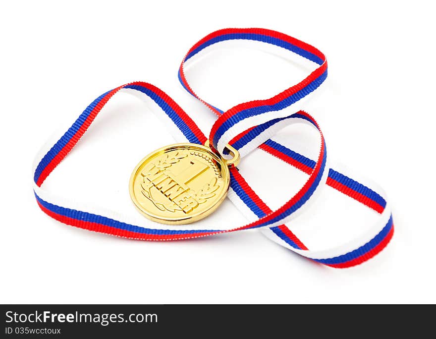 Golden medal and ribbon isolated on white background