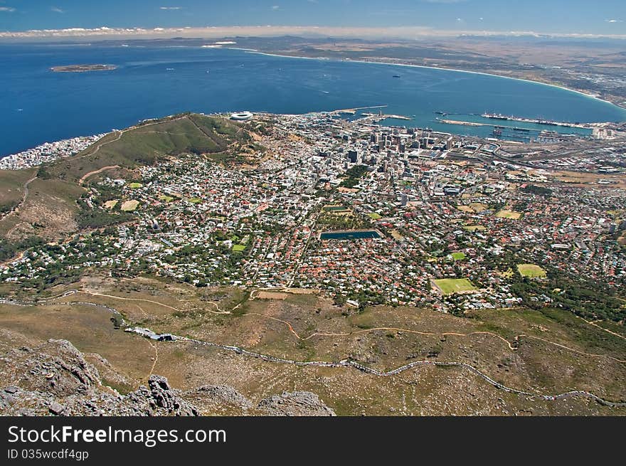 Aerial view of city of Cape Town as seen from table mountain with table bay and harbor and Green Point Stadium built for the FIFA 2010 world cup soccer. Aerial view of city of Cape Town as seen from table mountain with table bay and harbor and Green Point Stadium built for the FIFA 2010 world cup soccer