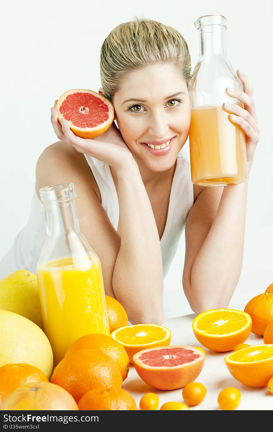 Woman with citrus fruit