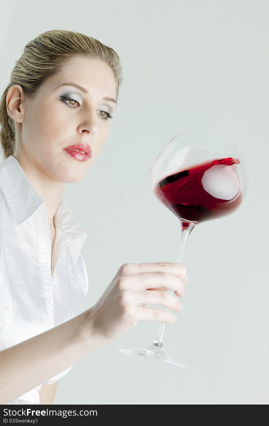 Portrait of young woman with a glass of red wine. Portrait of young woman with a glass of red wine