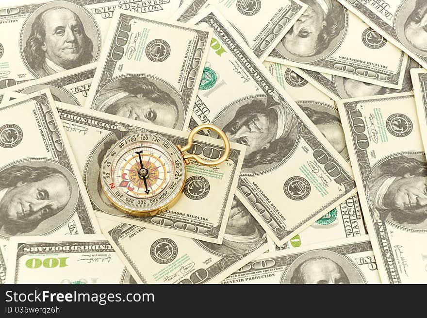 Dollars and compass. Concept about a direction in business