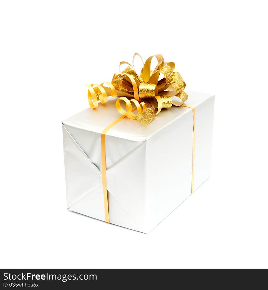 White gift with gold bow isolated on white background