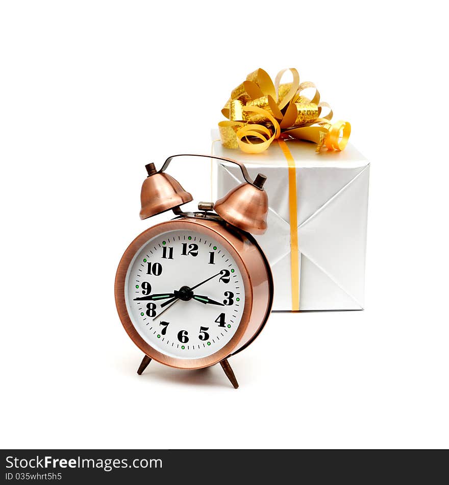 A retro clock with presents isolated on white bacground