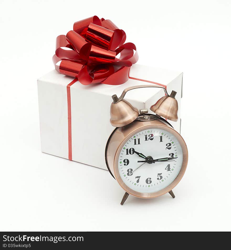 A retro clock with presents isolated on white bacground