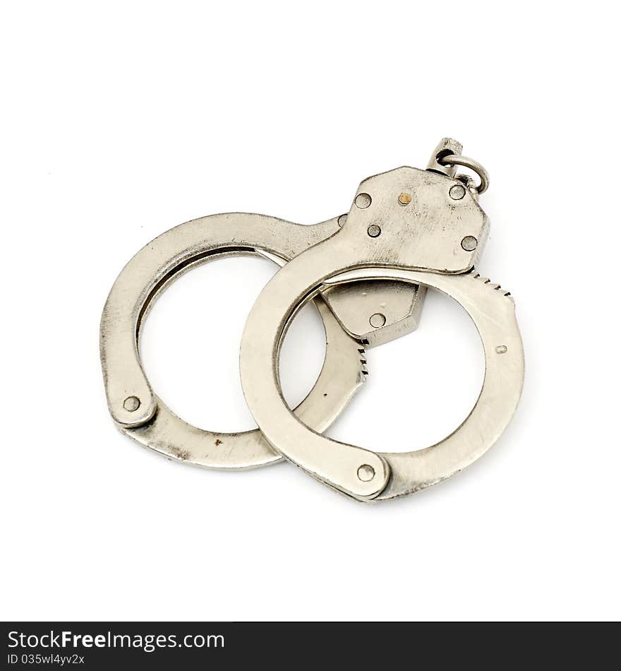 Steel metallic handcuffs (manacles) isolated on white background