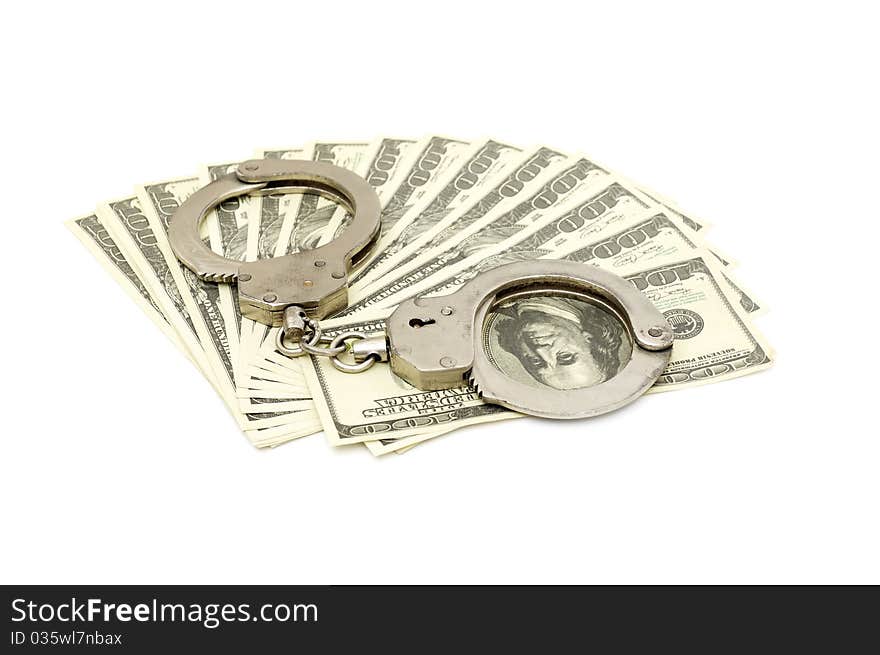 Handcuffs on money background, business security concept