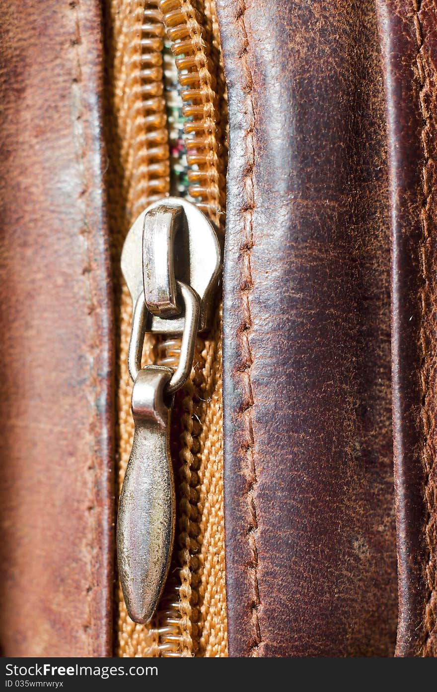 Zipper on brown leather