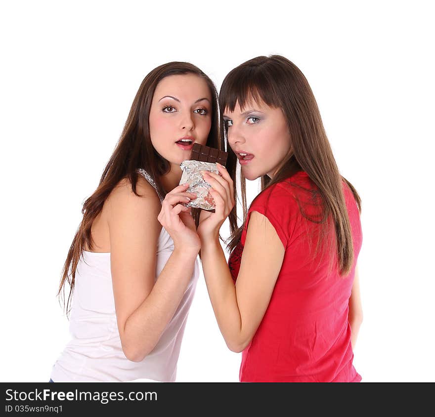 Two girls with chocolate. Isolated at white background