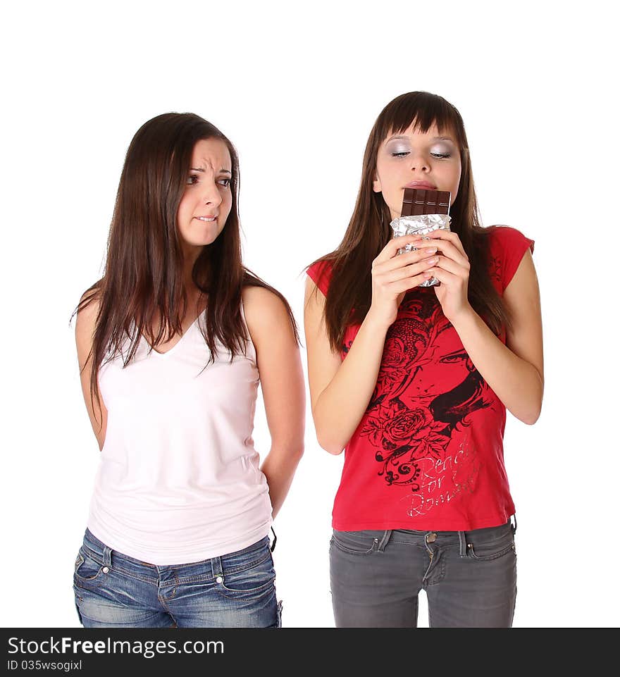 Two girls with chocolate. Isolated at white background