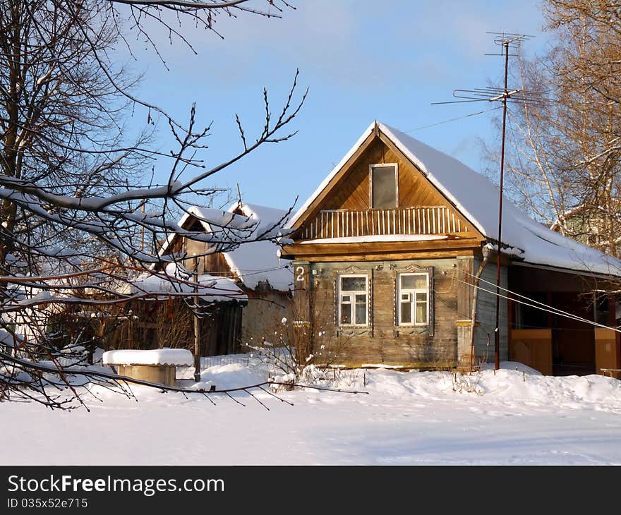 Wooden country house in Russia. Winter Landscape