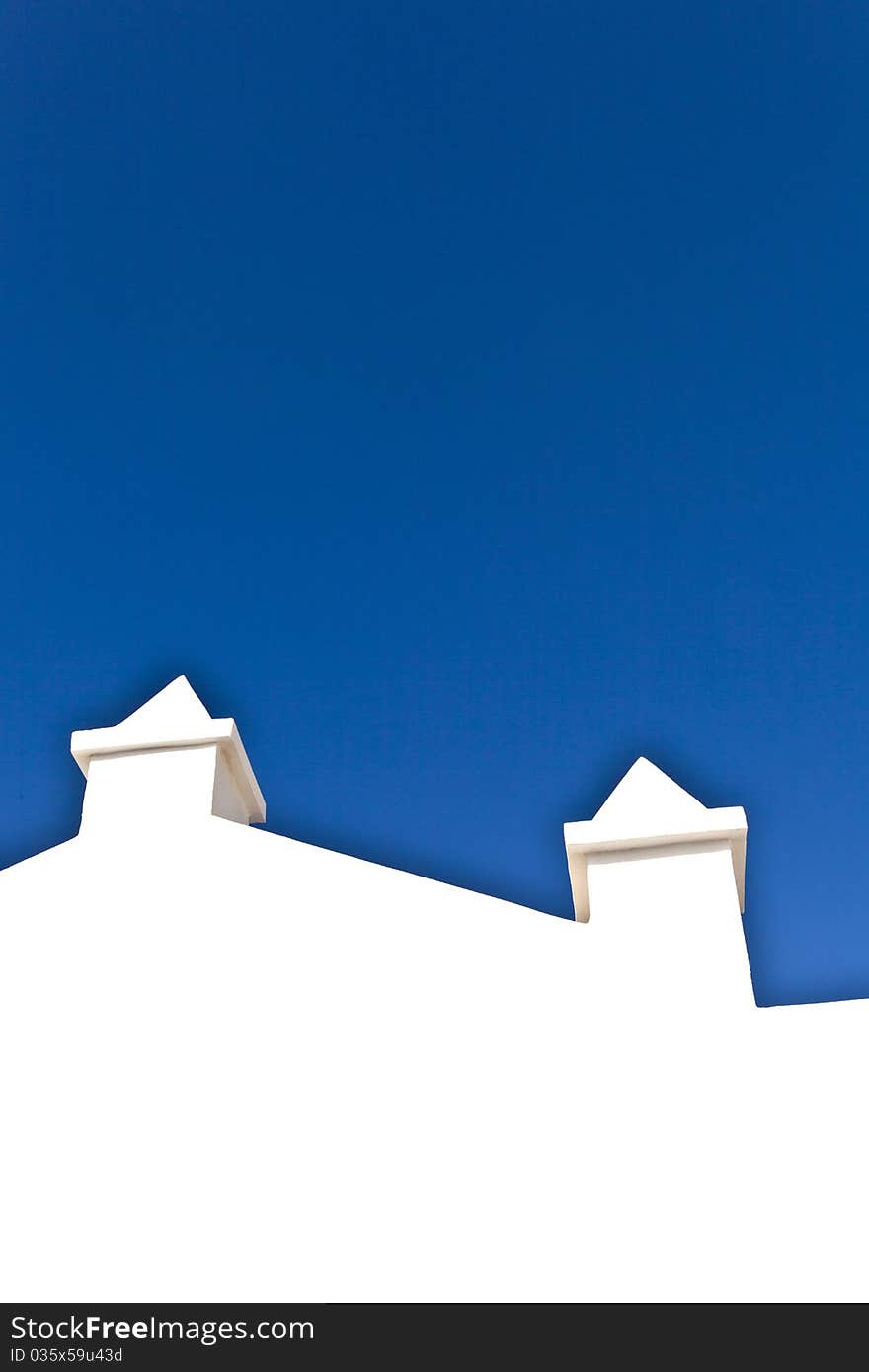 White wall with clear blue sky. White wall with clear blue sky