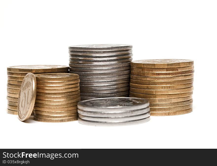 Coins stacked in a pile on a white background stacked in a pile on a white background