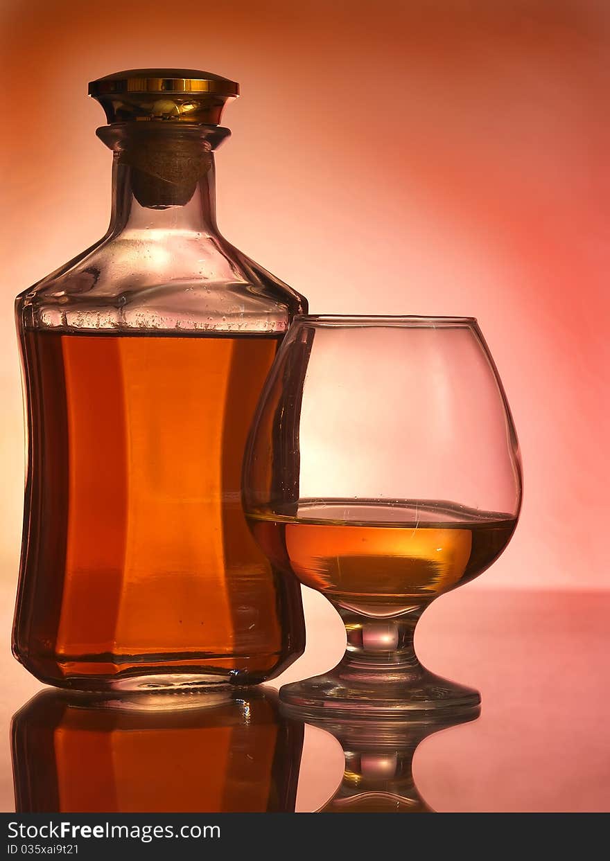 Cognac glass and bottle