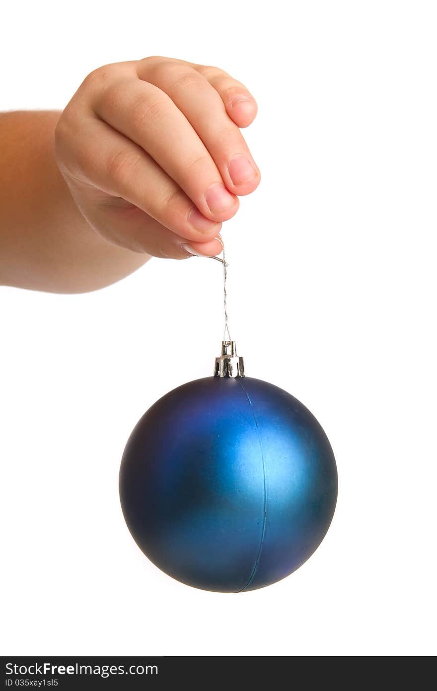 Blue christmass ball in child hand