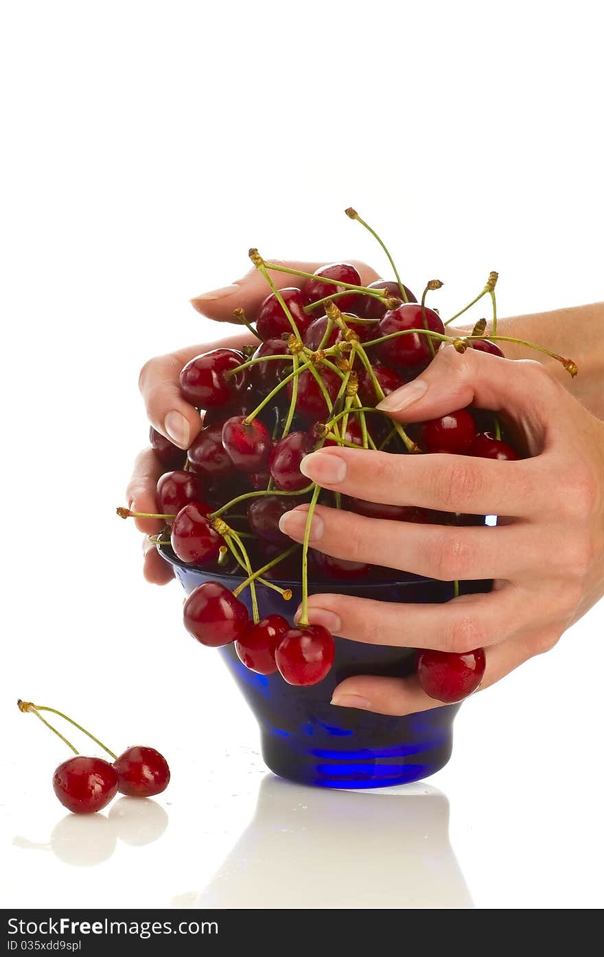 Cherries in bowl on white backgroung