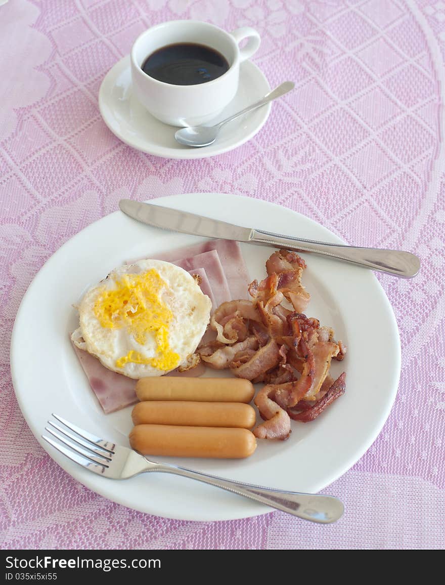 Breakfast Include ham, sausage, fried egg, coffee.