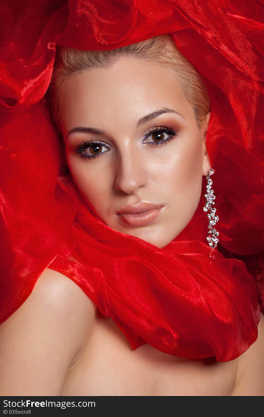 Beautiful woman with make-up in red