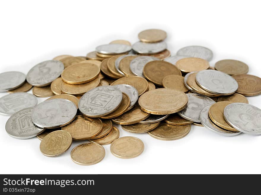 Coins from the yellow metal on a white background