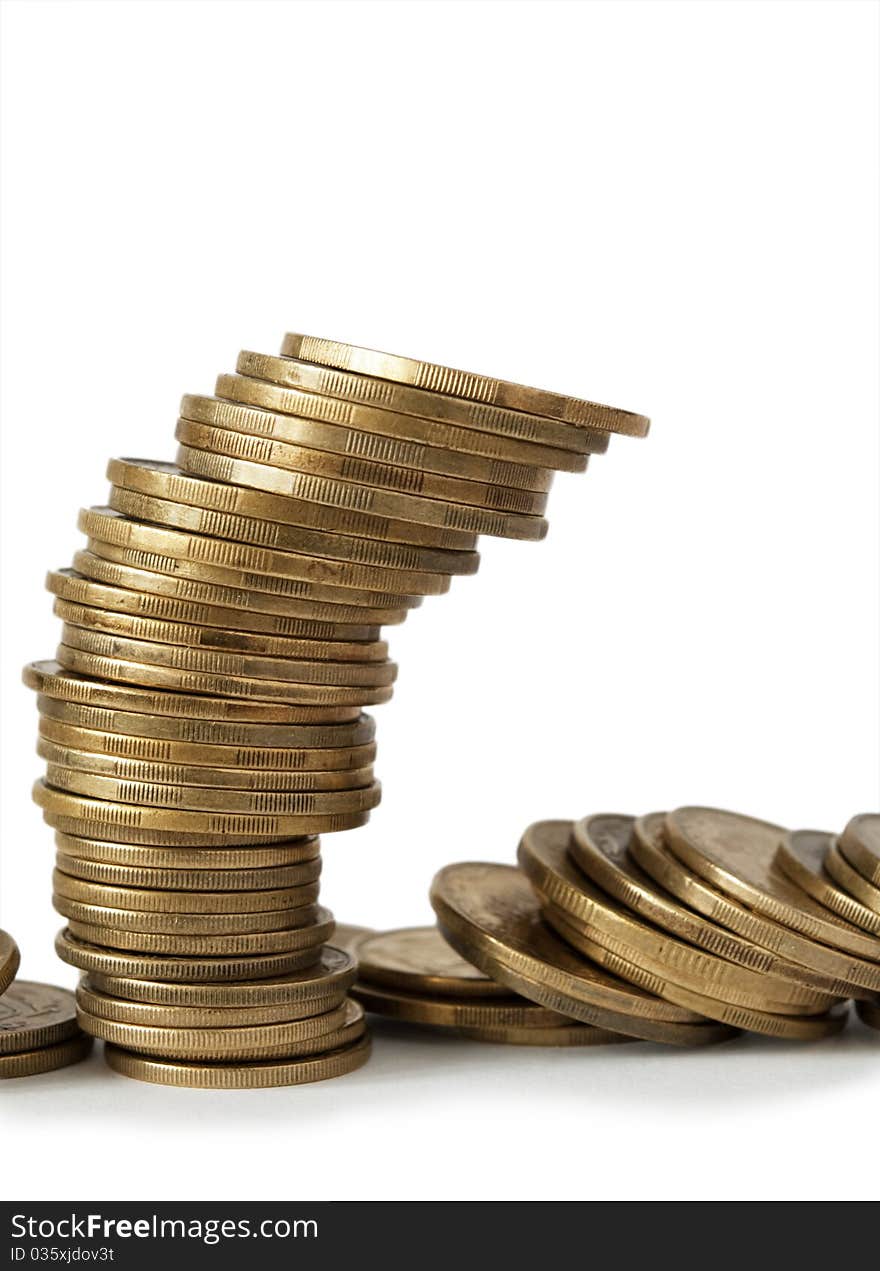 Coins from the yellow metal on a white background