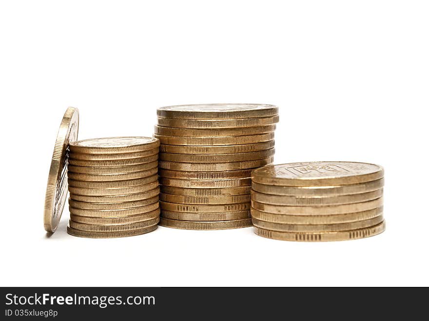 Coins stacked in a pile on a white background stacked in a pile on a white background