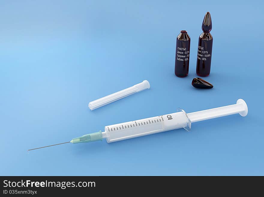 Syringe with capsules, isolated on a blue background. Syringe with capsules, isolated on a blue background