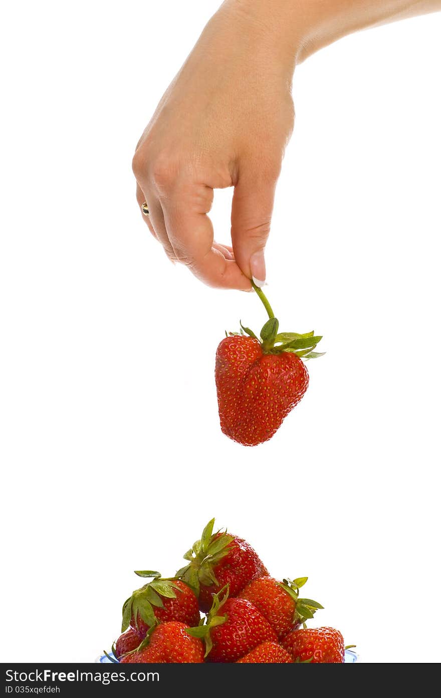 Strawberry in hands on white background isolated