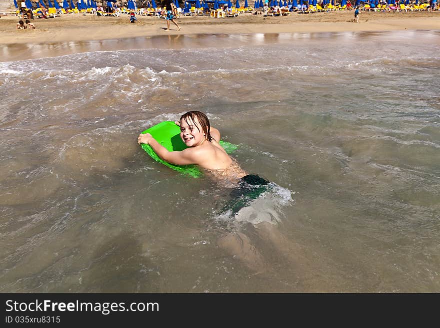 Cute boy with wet hair at the beach. Cute boy with wet hair at the beach