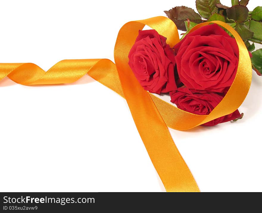 A bouquet of red roses with ribbon heart shaped on white background. A bouquet of red roses with ribbon heart shaped on white background