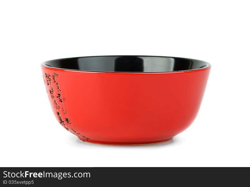 Empty red ceramic bowl isolated on the white background