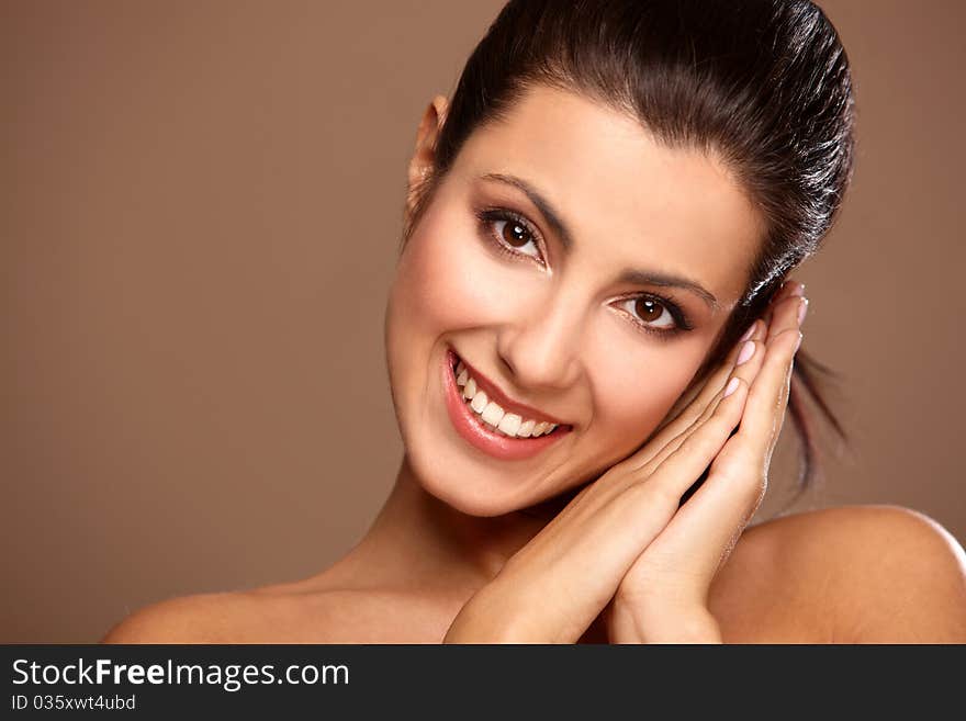 Portrait of beautiful smiling woman isolated on beige. Portrait of beautiful smiling woman isolated on beige