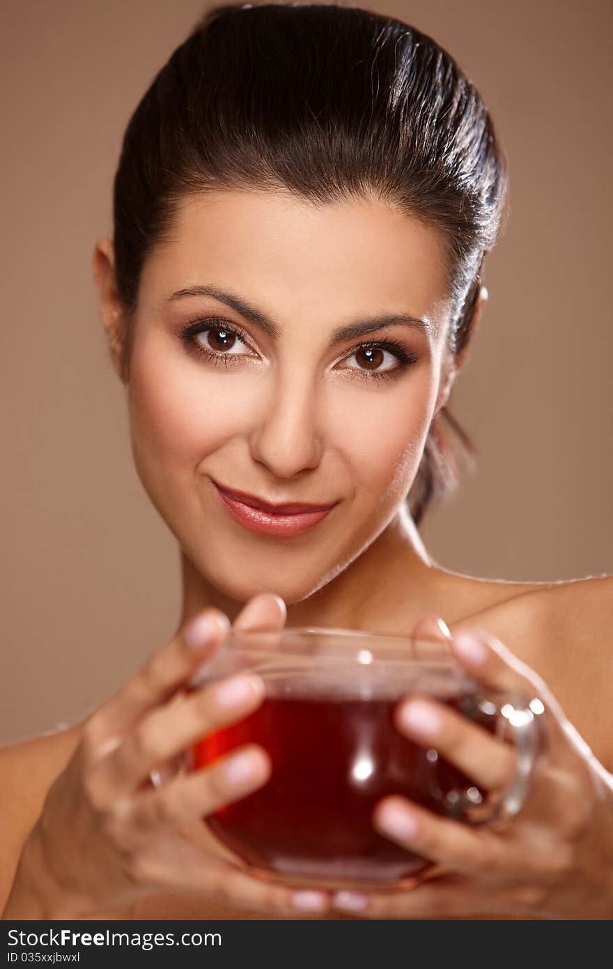 Portrait of a beautiful woman drinking tea