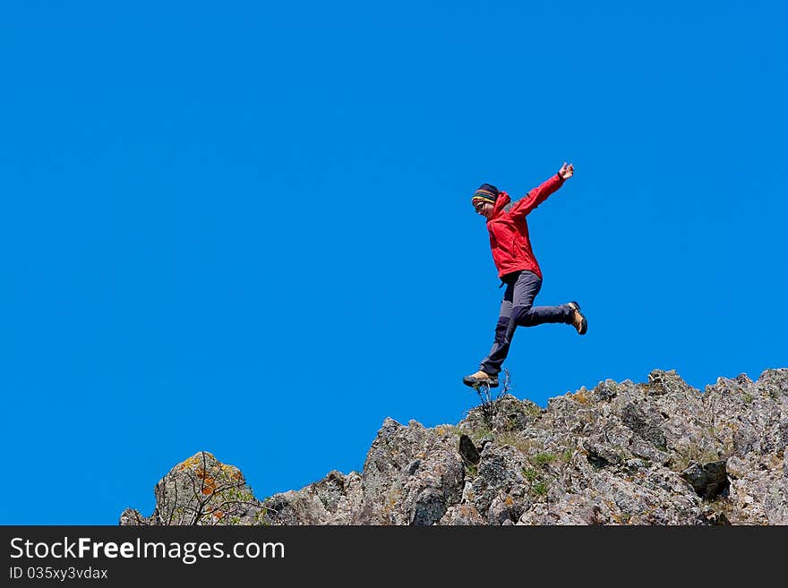 Girl jump in Crimea mountains. Girl jump in Crimea mountains