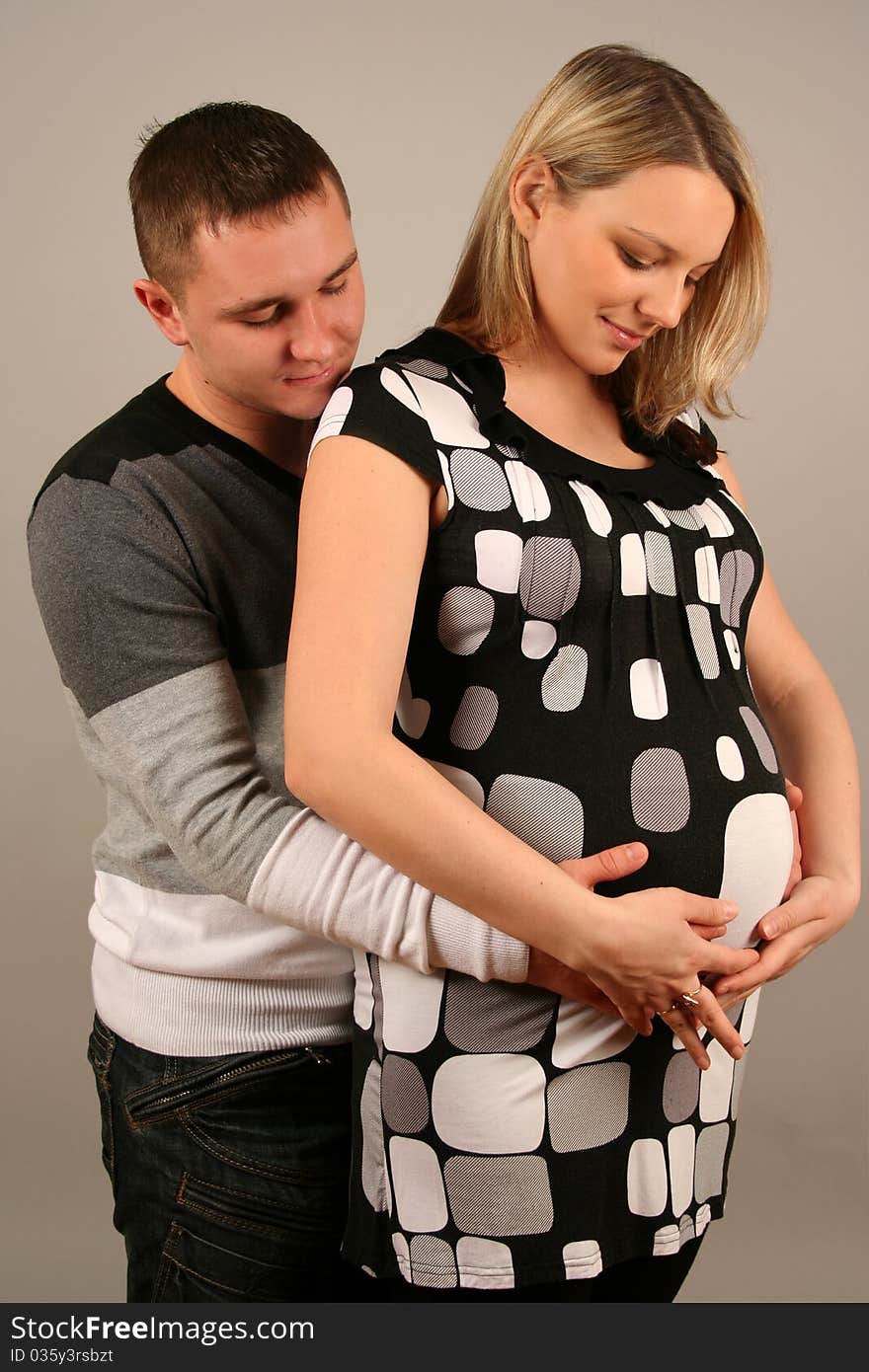 Beautiful young couple waiting baby