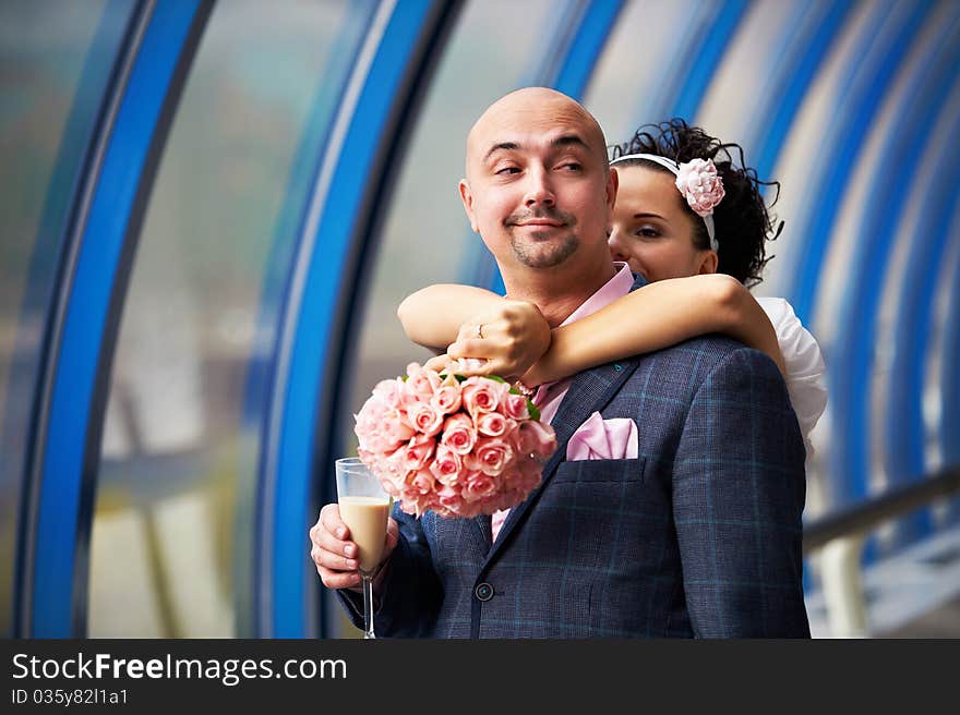 Bride hugging her groom at the wedding walk